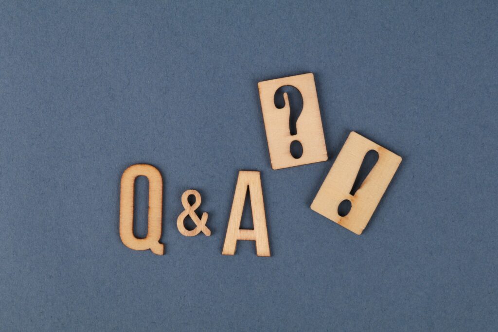 Wooden blocks spell out Q & A indicating the beginning of a FAQ about Career Coaching